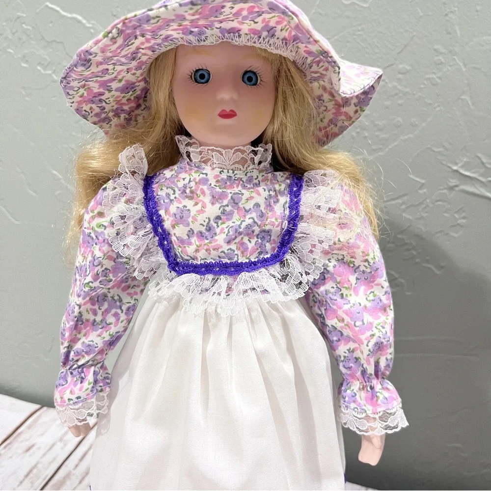 Porcelain Doll with purple floral dress and‎ Hat vintage
